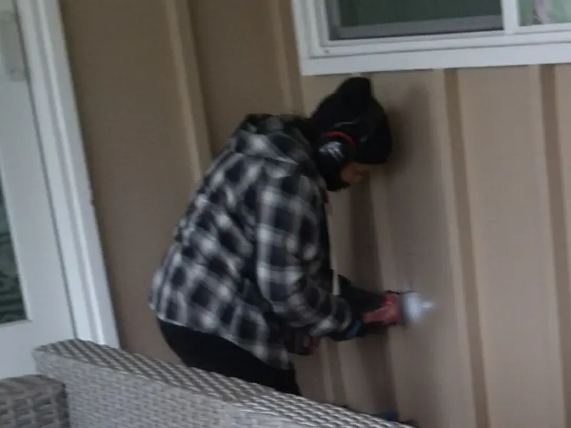 Professional electrician installing an exterior outlet in Algood