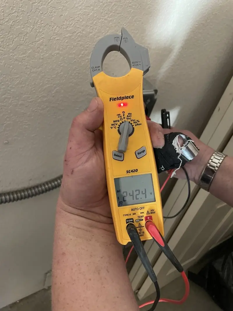 Voltage testing with clamp meter during Electrical Installation Services in Algood